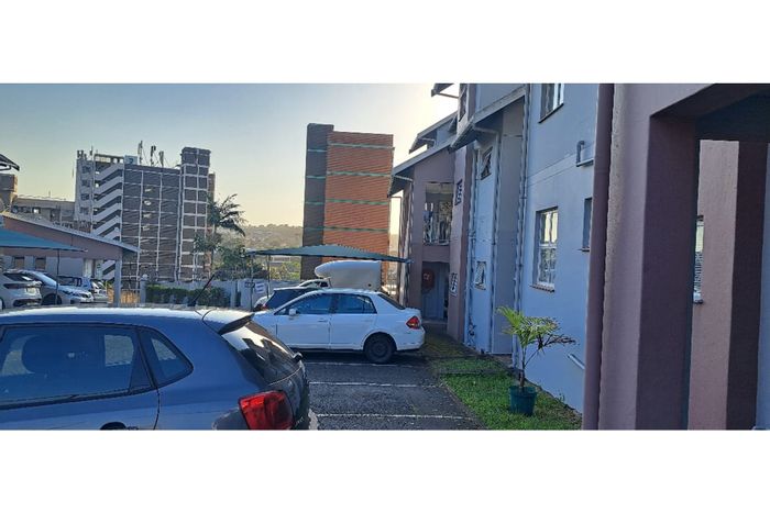 2-Bedroom Apartment For Sale in Sydenham with secure parking and courtyard access.