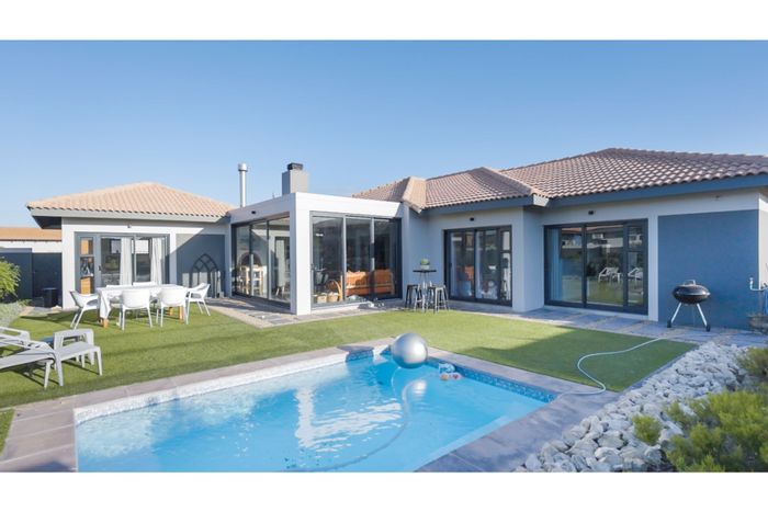 For Sale: House in Langebaan Country Estate with pool, golf course access, and security.