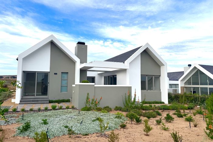 For Sale: House in Langebaan Country Estate with golf access, BBQ area, and greenbelt views.