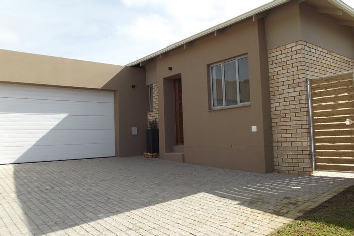 For Sale: House in Mooikloof Country Estate with 3 beds, double garage, and braai.