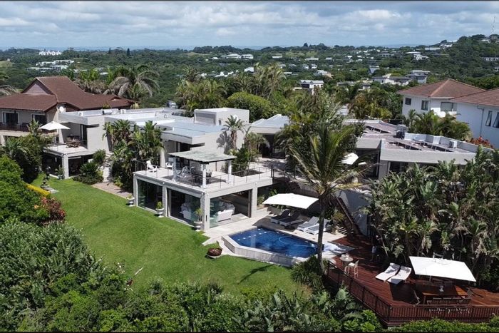 For Sale: 6-Bedroom House in Sheffield Beach with pool, garages, and ocean views.