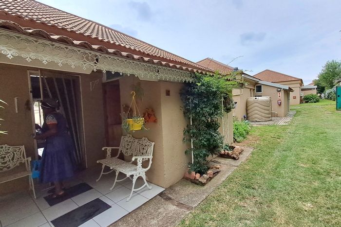 3-Bedroom Townhouse in Parys Central For Sale with garage, laundry, and patios.