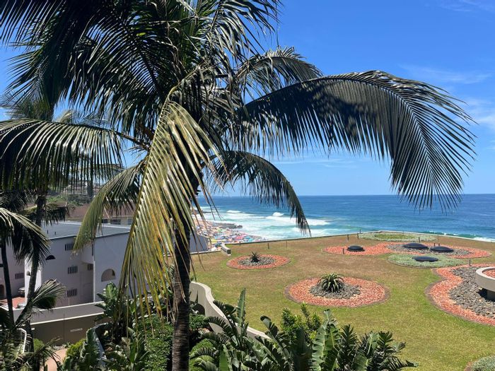 For Sale: Apartment at Compensation Beach with beachfront access, security, and income potential.