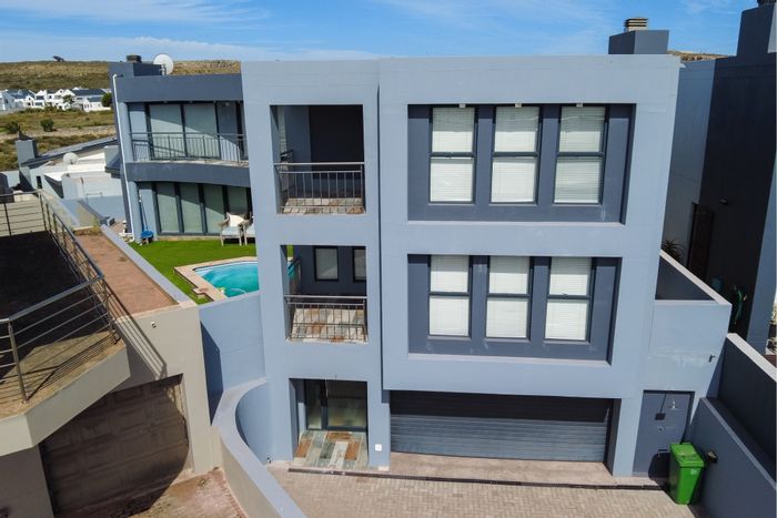 Calypso Beach House For Sale: Exclusive access, pool, spacious living, and secure community.