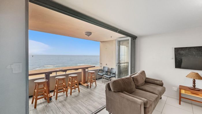 For Sale: 2BR South Beach Apartment with balcony, security, and parking.
