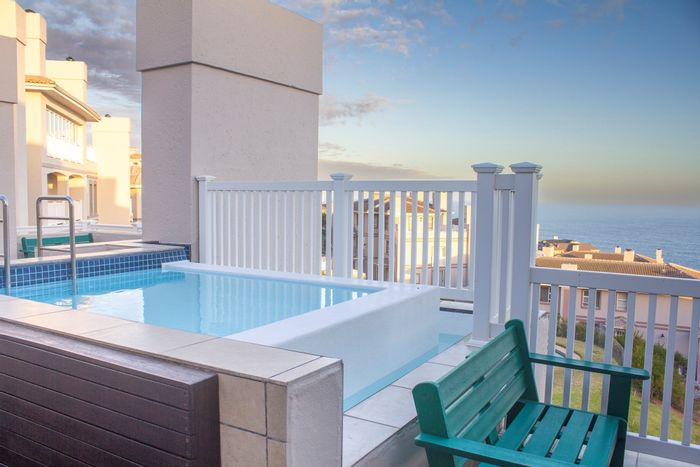 Penthouse For Sale in Pinnacle Point Golf Estate: Ocean views, jacuzzi, secure living.