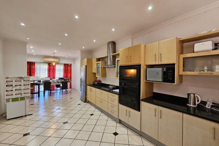 For Sale: Spacious 4-Bedroom House in Bombay Heights with Dual Access and Garage.