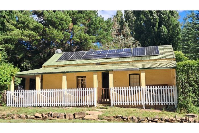 Historic Rhodes house for sale with off-grid living, guest suite, and spacious garden.