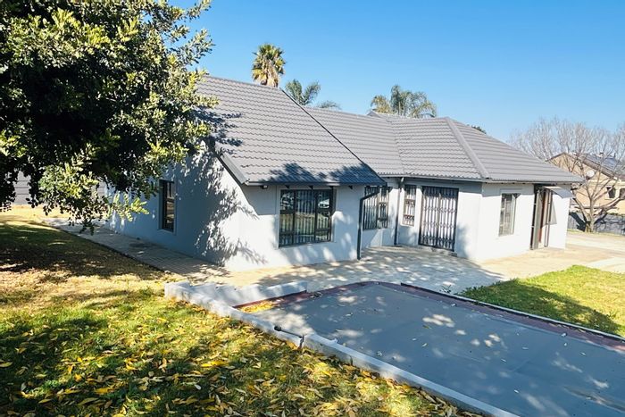 For Sale: House in Halfway Gardens with flatlet, cottage, pool, and large yard.