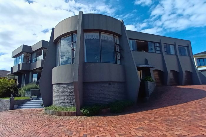 For Sale: House in Blue Bend with pool, multiple living spaces, and ocean views.