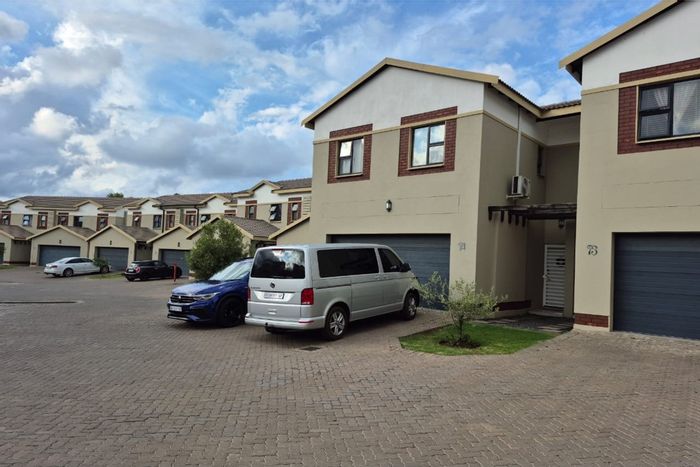 For Sale: 4-Bedroom Townhouse in Equestria with garden, double garage, and secure estate.