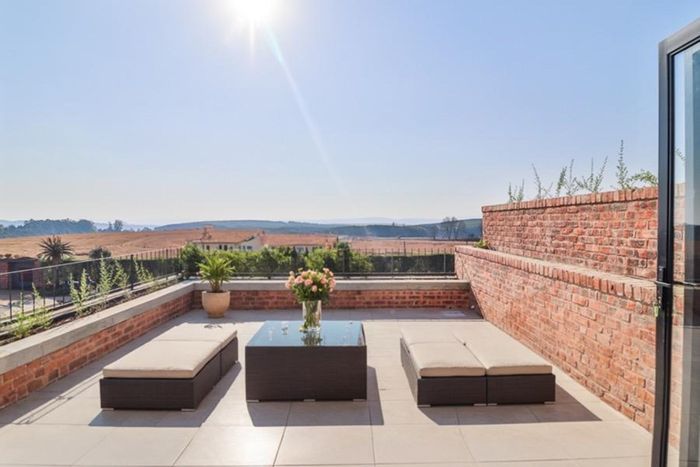 For Sale: Townhouse in Hilton Central with rooftop garden, en-suite bedrooms, and eco estate amenities.