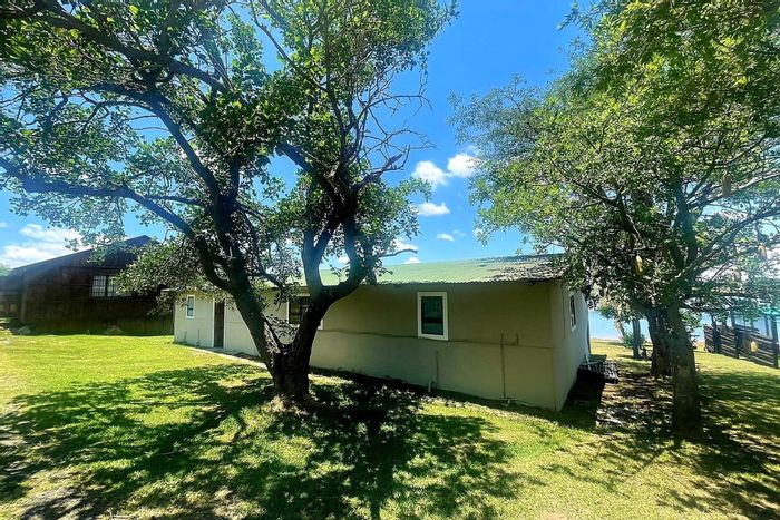 For Sale: House in Badplaas Central with waterfront, solar panels, and outdoor amenities.