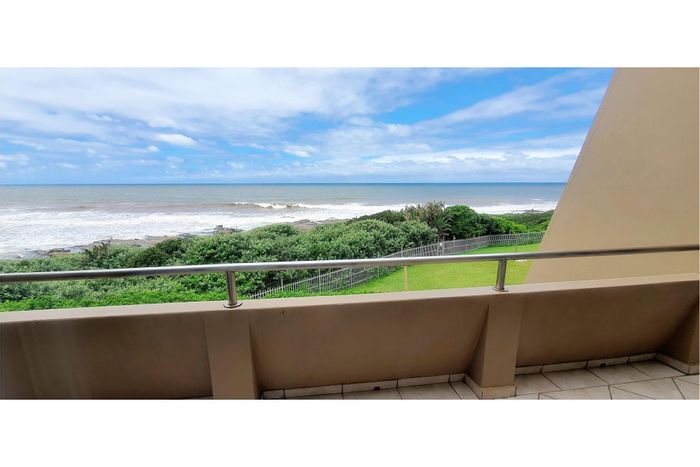 Beachfront townhouse in Shelly Beach for sale with pool, sea views, and security.