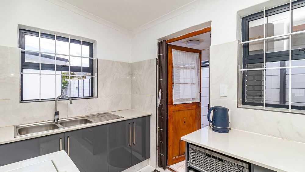 Kitchen with door that leads outside