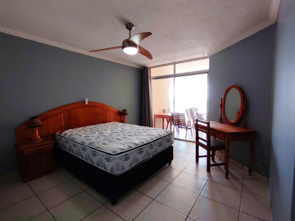 Main bedroom with door to enclosed balcony