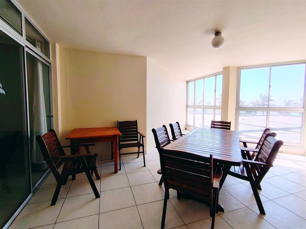 Enclosed balcony with windows that open