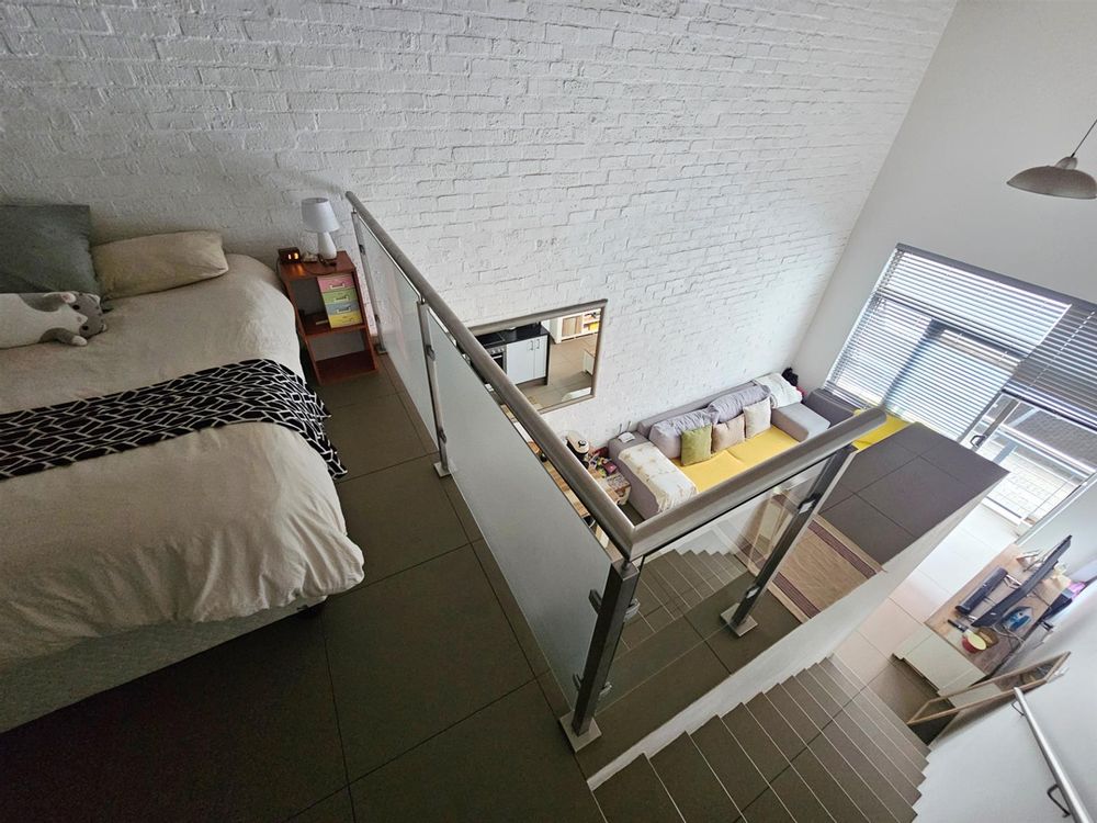 Loft bedroom with downstairs