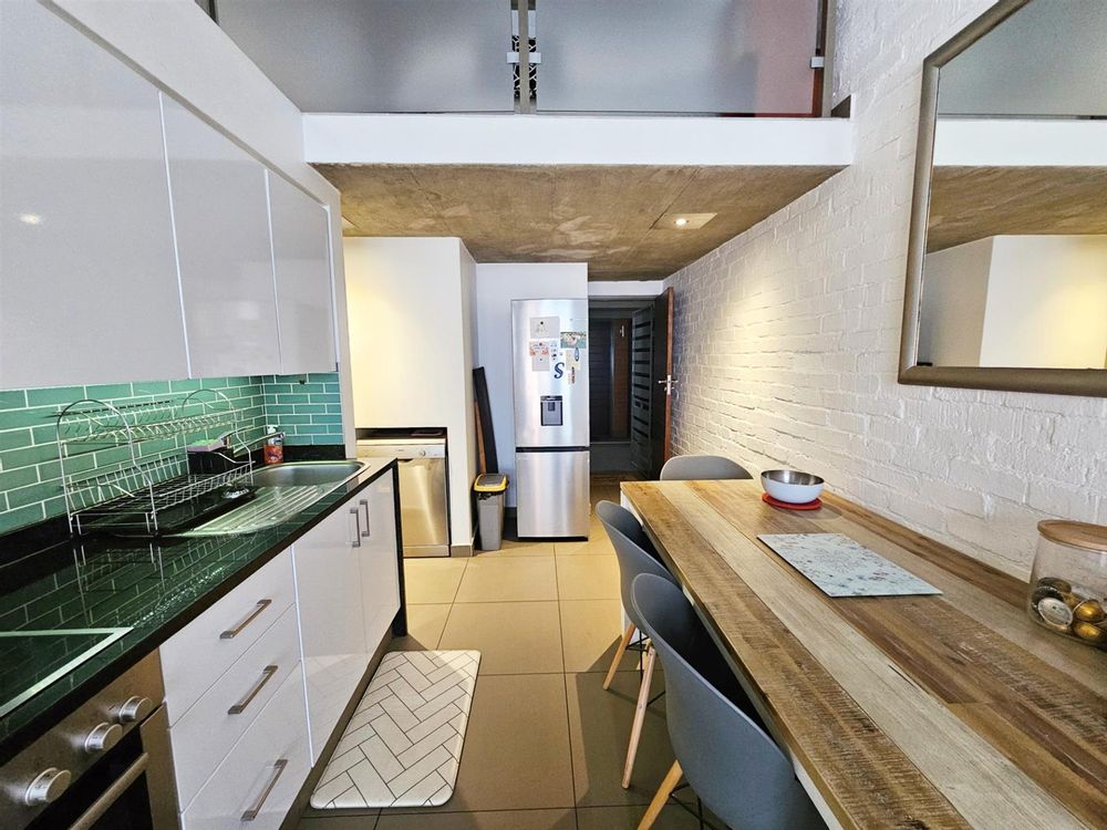 View if front entrnce, fridge and dishwasher