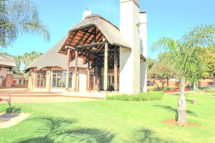 For Sale: 2-Bedroom Apartment in Mooikloof Ridge with clubhouse, pool, and tennis court.