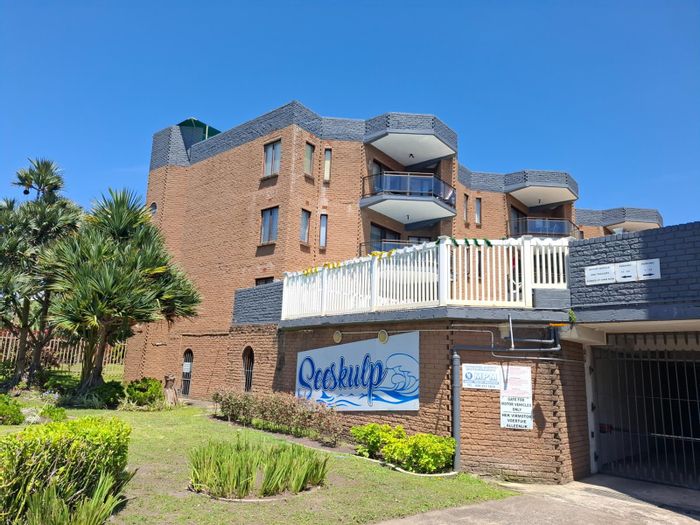 Coastal apartment for sale in Uvongo Beach with parking and spacious layout.