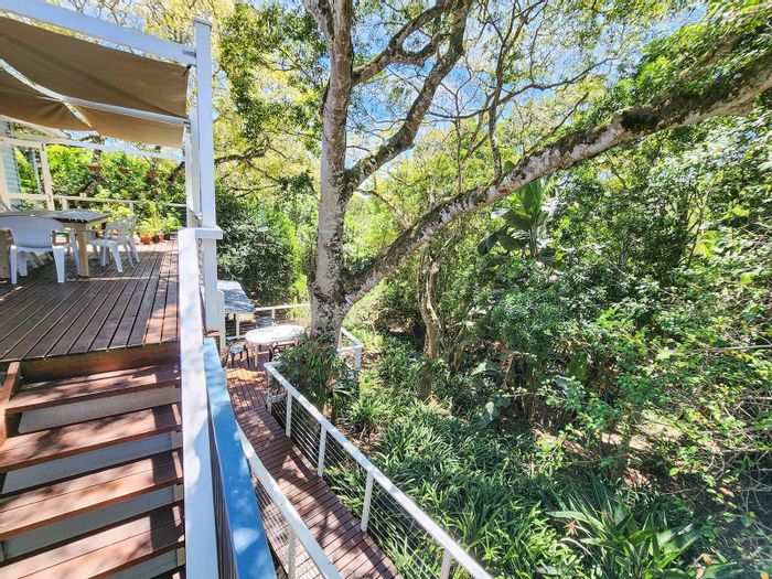 For Sale: House in Brenton On Lake with flatlet, decks, and ample parking.
