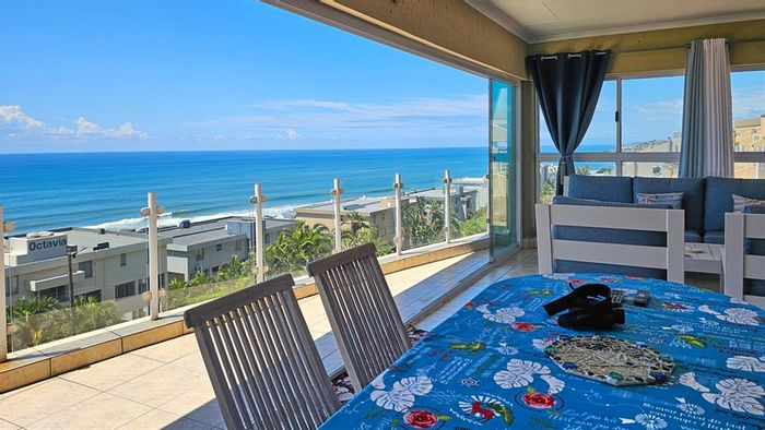 Ocean-view apartment in Manaba Beach for sale, featuring spacious balcony and pool.