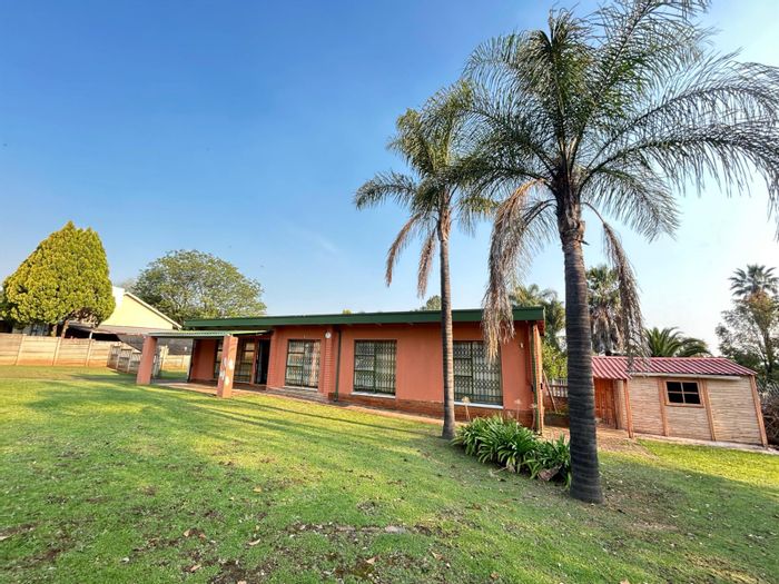 For Sale: Spacious 4-bedroom house in Sunnyridge with secure yard and parking.