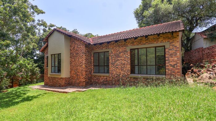 For Sale: Townhouse in Sonheuwel with garden, security, and double garage.