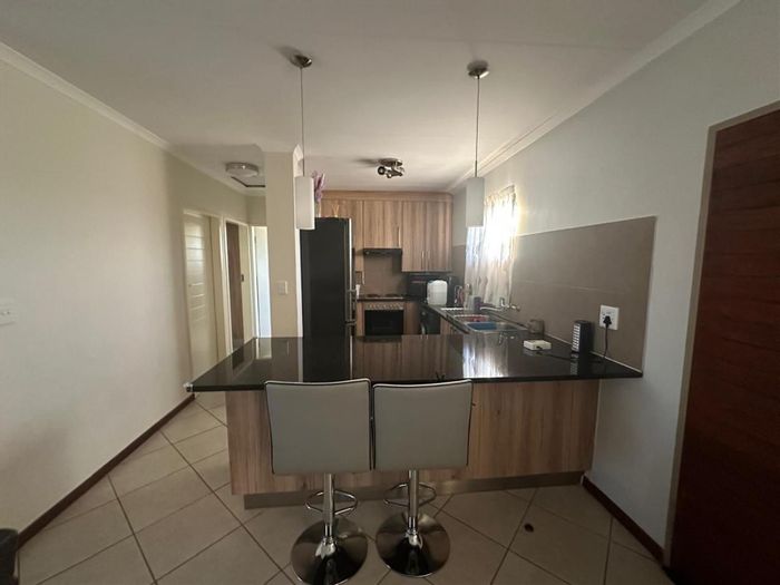 2-Bedroom Apartment For Sale in Monavoni with secure yard and carport.