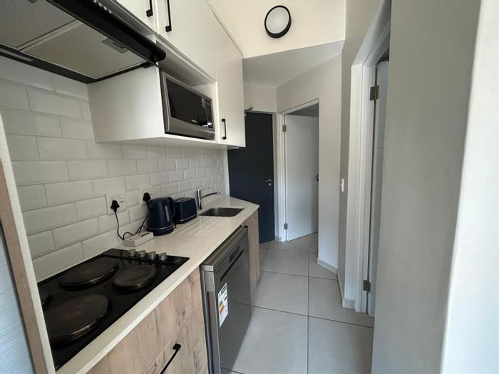 Two-bedroom loft apartment in Fourways with pool, gas braai, and prepaid electricity. To Rent.