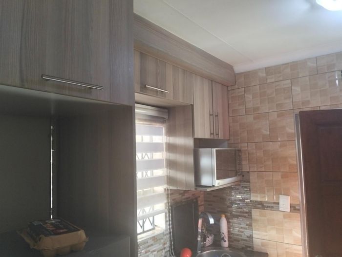 2-Bedroom House for Sale in Clayville with Open-Plan Living and Security Features.