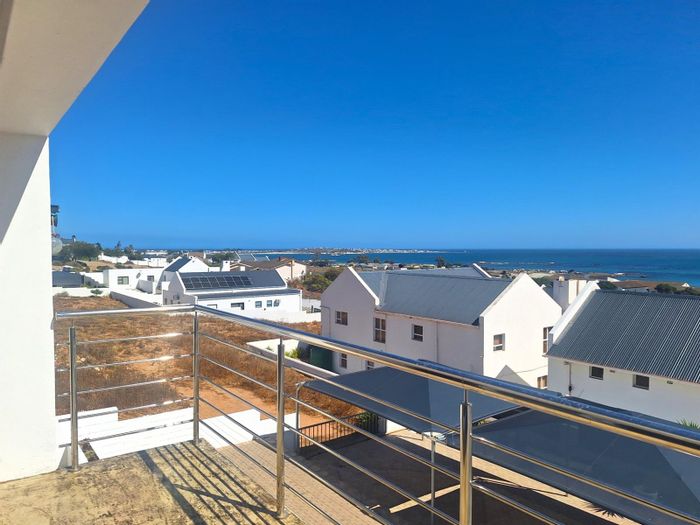 Elevated Da Gama Bay house for sale with sea views, dual-level living, and off-grid features.