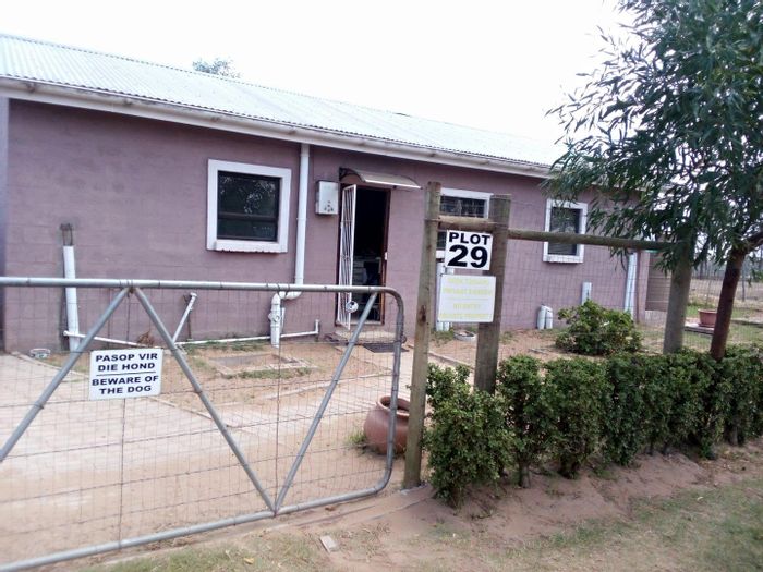 Farm for Sale in Albertinia Central: 2-bed home, off-grid, potential for farming.