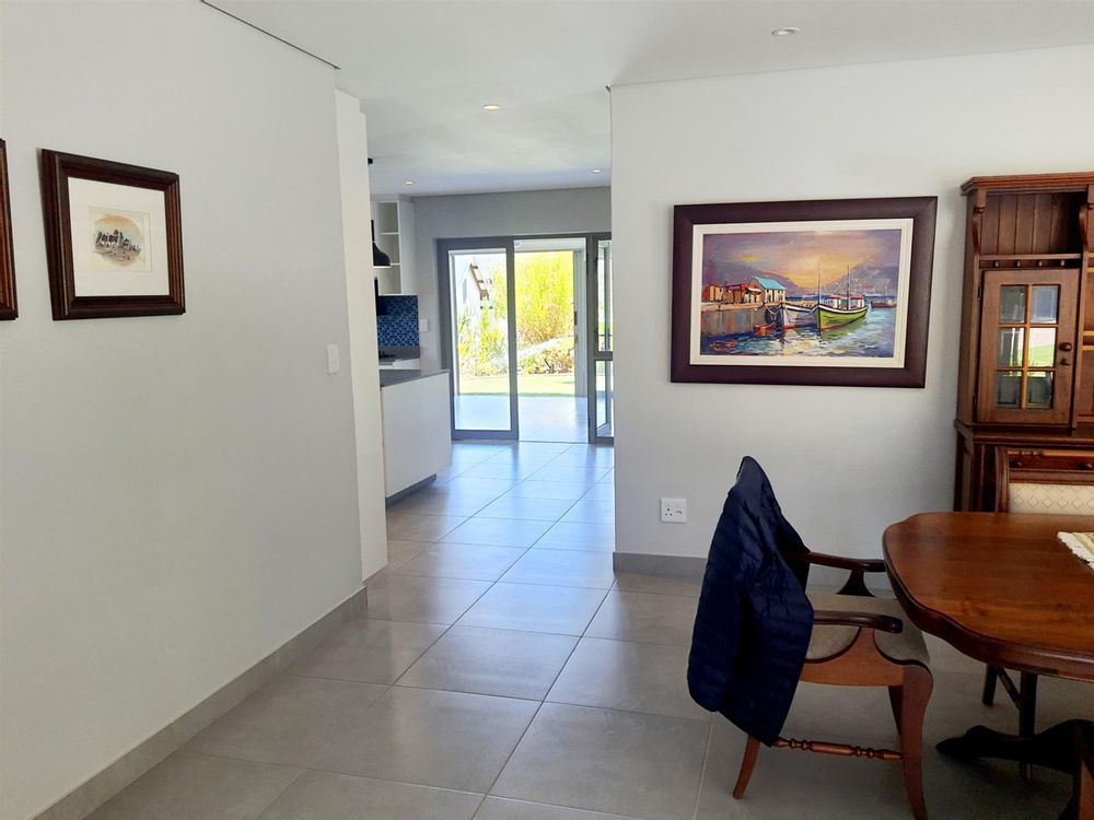 Dining room with kitchen in background