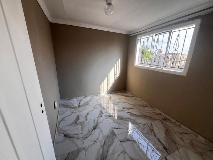 2 Bedroom House For Sale in Stretford with spacious yard and practical layout.