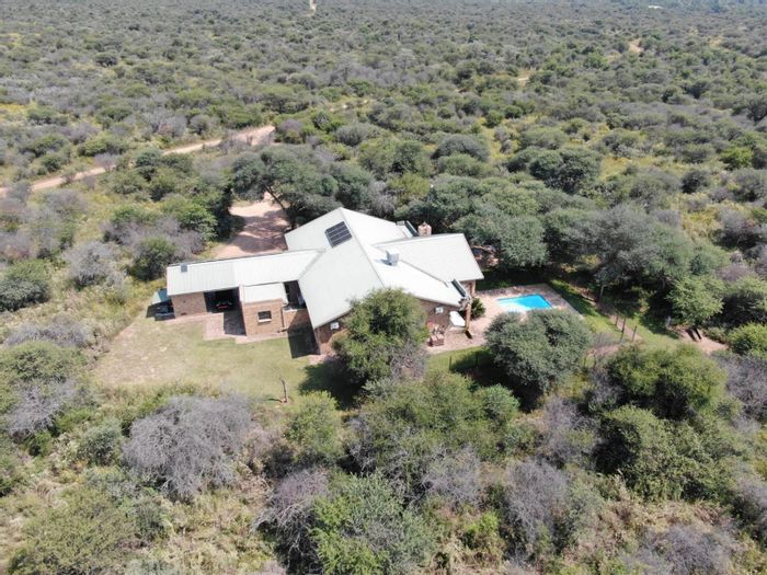 For Sale: House in Shona Langa with pool, bar, and nature reserve access.