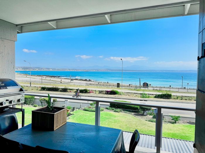 Beachfront apartment in De Bakke for sale with garage, ocean views, and security.