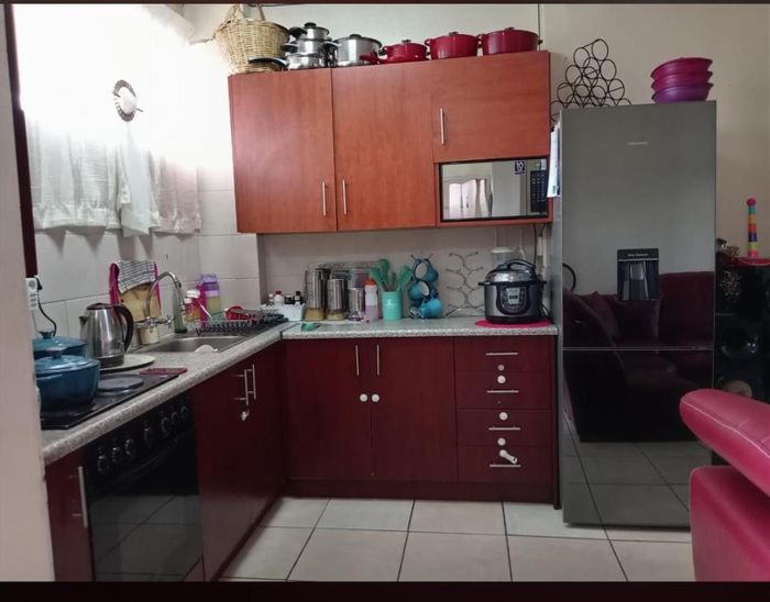 To Rent: Apartment in Sasolburg Central with 2 bedrooms, garage, and 24-hour security.
