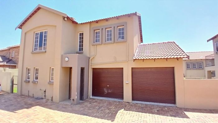 3-Bedroom Townhouse To Rent in Ruimsig with secure parking and outdoor area.