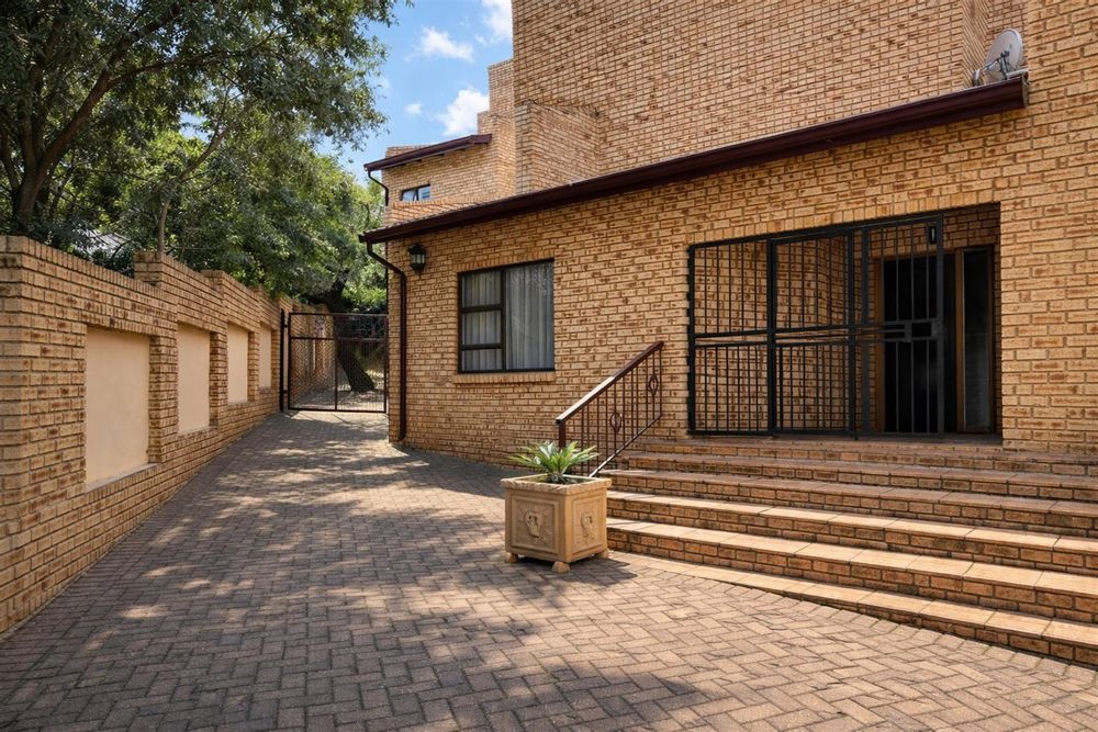 Front of house + side passage & front door