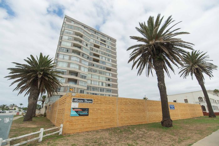 Ocean views, secure parking, and lift access in Summerstrand apartment for sale.