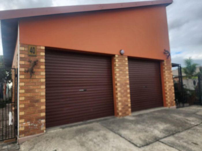 Two-bedroom house to rent in Waterval East with en-suite baths and security.