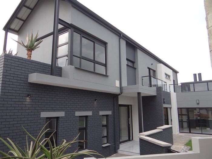 For Sale: House in Midstream Estate with 4 bedrooms, open-plan kitchen, and patio.