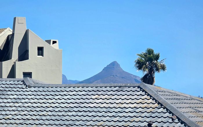 For Sale: Beachfront Apartment in Table View, 2 Bedrooms, Ocean Views, Investment Potential.