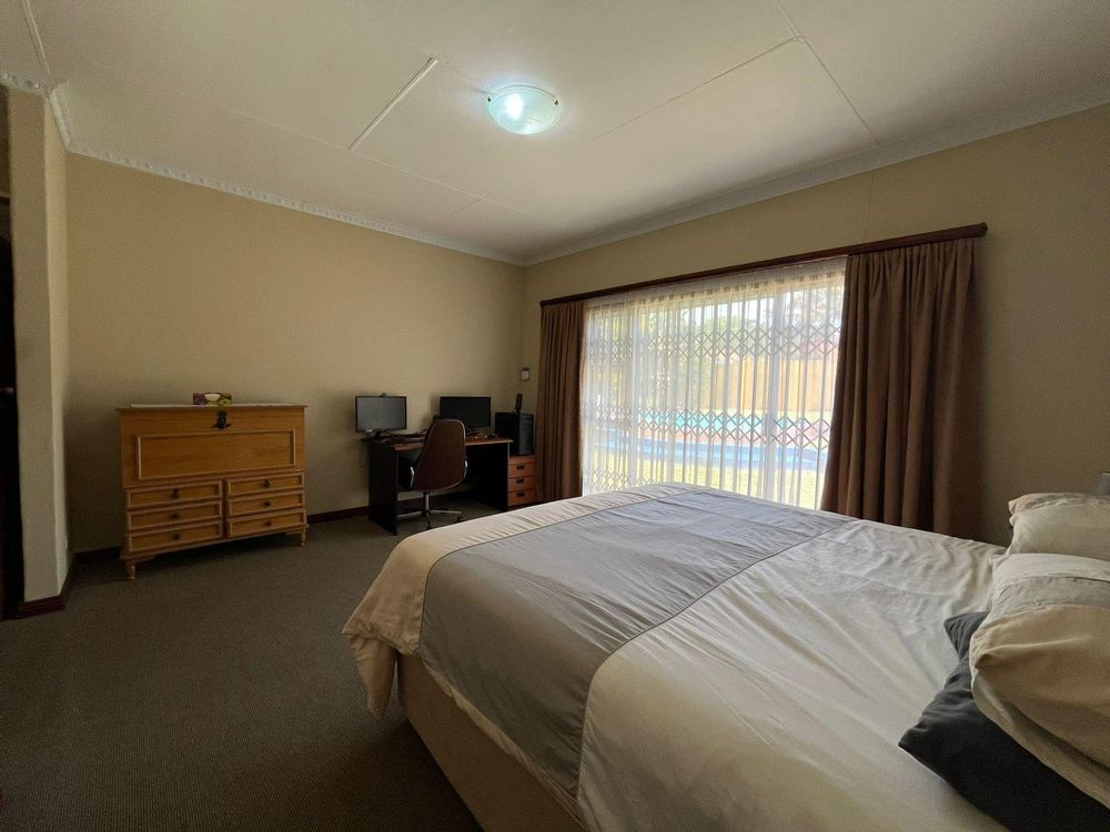 Main bedroom with sliding doors and security doors