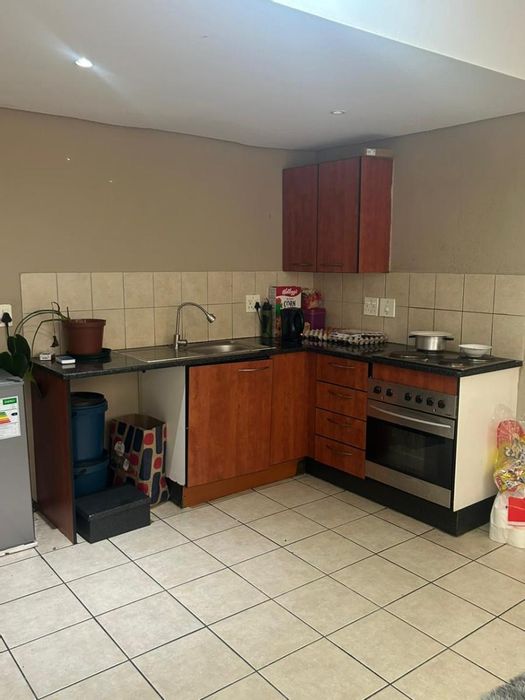 Braamfontein Apartment For Sale: 1 Bedroom, Lounge, Kitchen, and Bathroom included.
