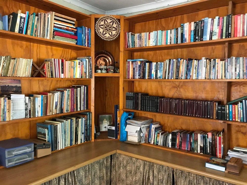 Large study/office with lots of shelving