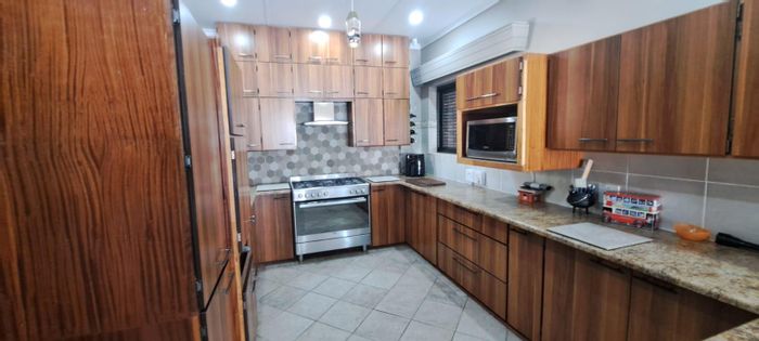 For Sale: Spacious 4-Bed House in Stilfontein Central with pool and double garages.