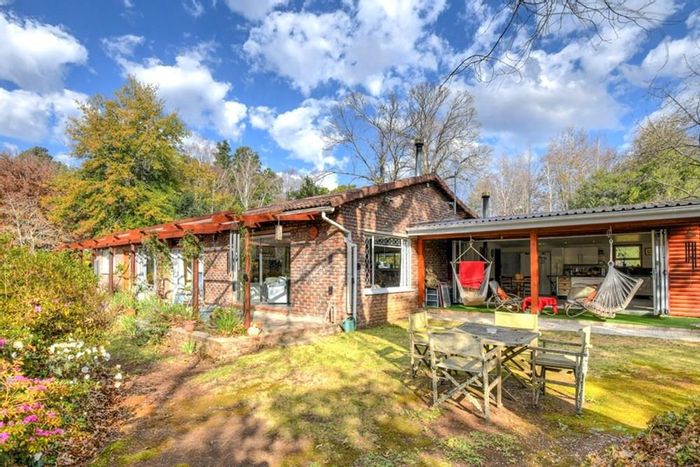 Hogsback Central House For Sale: Income-generating estate with gardens and rental cottages.